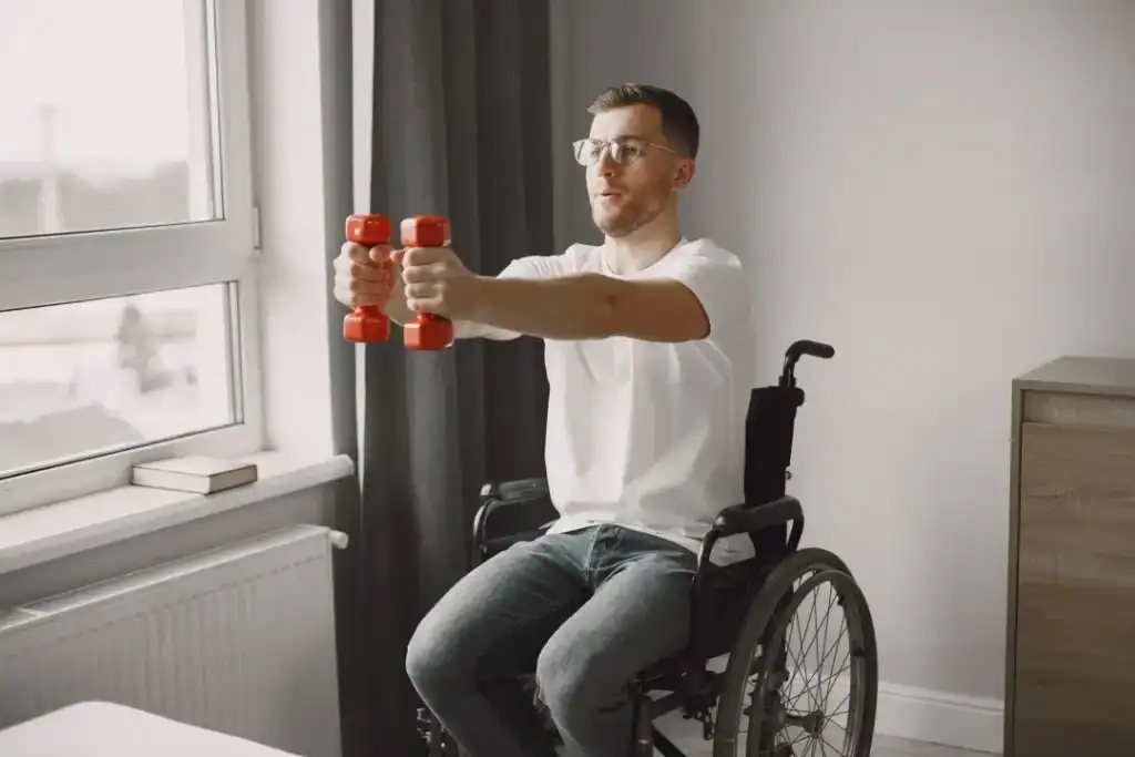 Image of man doing exercise in his wheelchair to aid weight loss Bridport