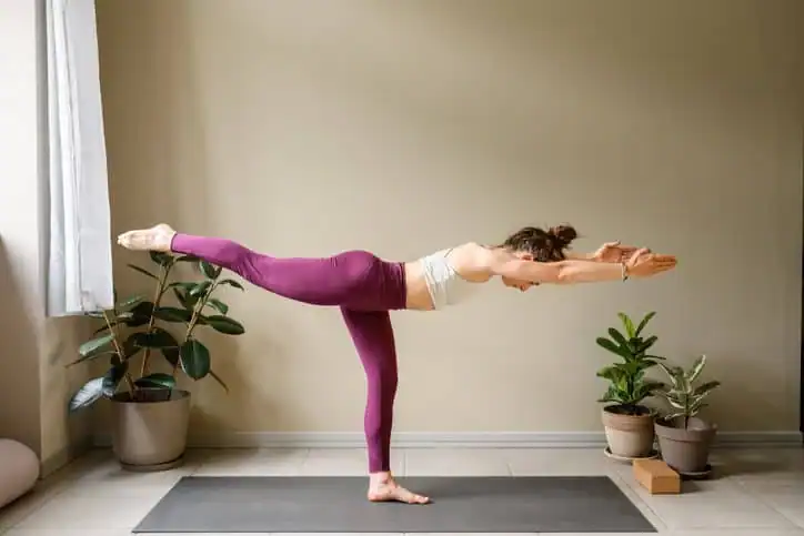 Achieving the Perfect Tone: How Often Should You Exercise for Results? 1 Woman doing Yoga exercise Bridport to help with toning the body.