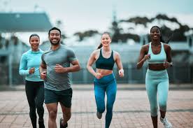 Sculpting Sleek Arms: The Essential Role of Cardio in Toning Without Bulking Up 3 image of people running to incorporate cardio Bridport exercise into their life to help tone arms and body.